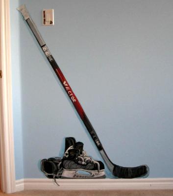 Hockey stick and skates Hockey stick and skates