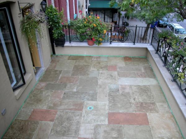 Cement patio treated with jewelstone