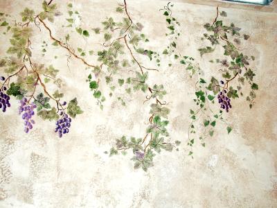 leaves and grapes on textured wall